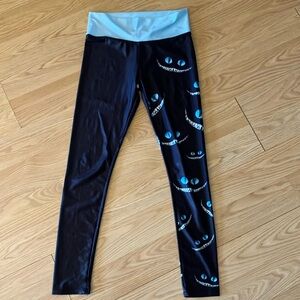 Stylish Black and Blue Leggings with Artistic Design